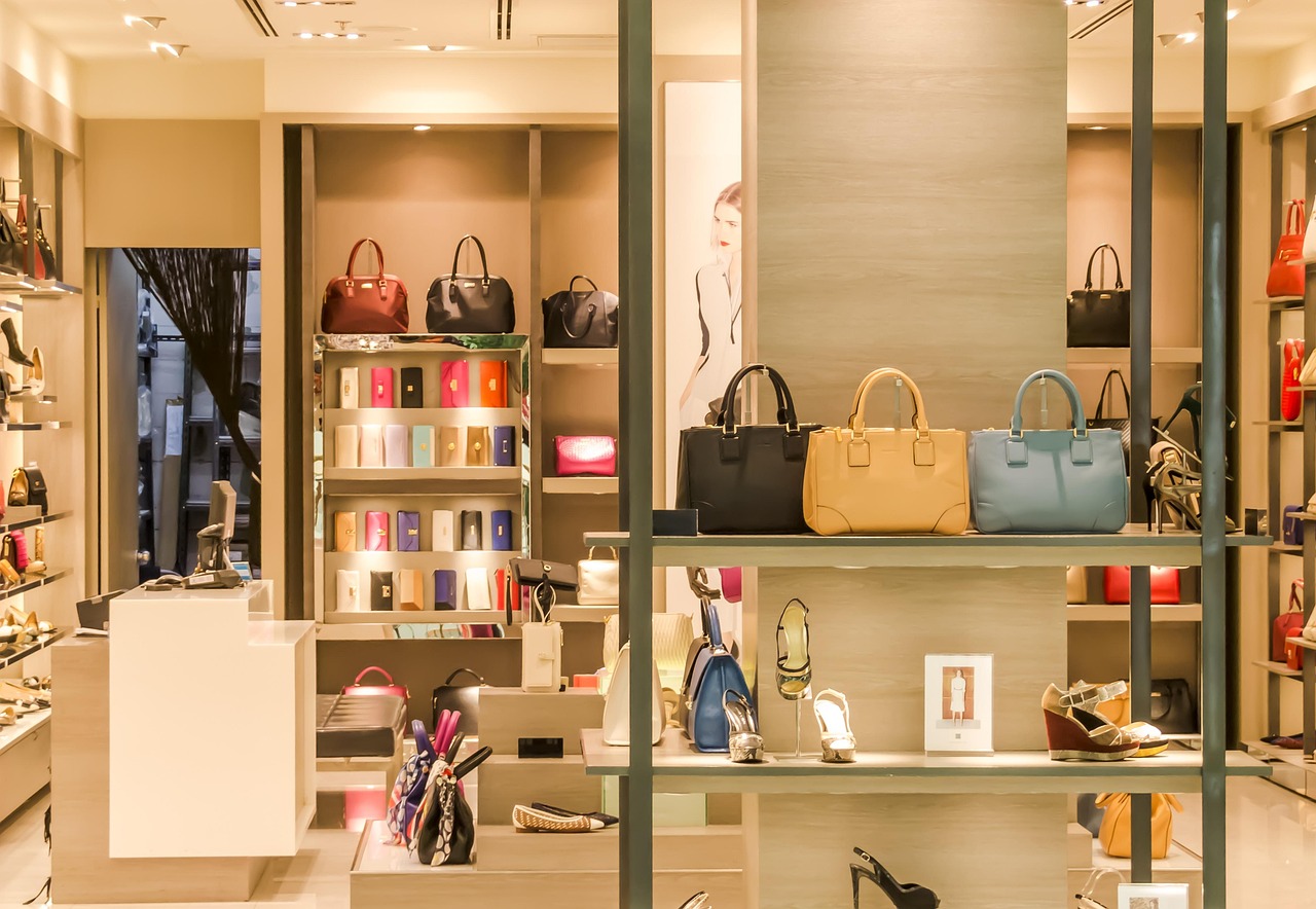 Boutique shop with apparel, bags, and shoes on display